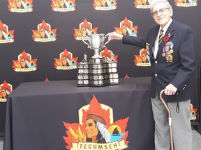 Donald Lappan is shown with the Memorial Cup.