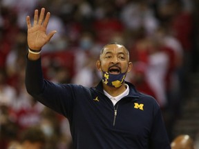 Michigan Wolverines head coach Juwan Howard directs his team during the game with the Wisconsin Badgers at the Kohl Center in Madison, Wisc., Feb. 20, 2022.