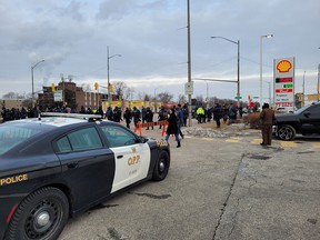 Police aggressively move media away from Huron Church as they advance on protesters.