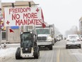 A convoy of vehicles, unofficially estimated at about 200, rolled through Aylmer twice on Thursday Feb. 3, 2022. The protest was made up mainly of pickups and minivans, some adorned with signs that read ‘no more mandates’ and Canadian flags. (Mike Hensen/The London Free Press)