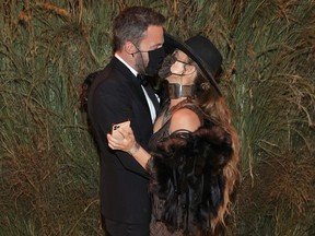 Jennifer Lopez and Ben Affleck attend the Met Gala wearing masks last year.