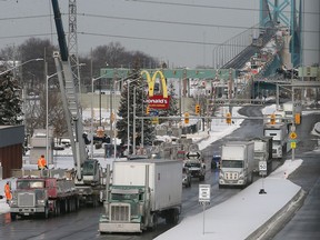 Trucks are shown on Huron Church Road near the Ambassador Bridge in Windsor on Monday, Feb. 14, 2022.