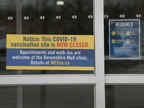 COVID-19 signage is shown at the main entrance at the WFCU Centre on Monday, February 28, 2022.
