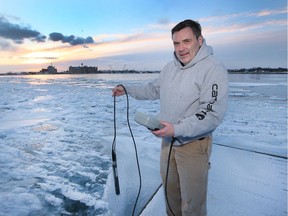 Winter watch. Mike McKay, executive director of the Great Lakes Institute for Environmental Research, is shown with a water quality monitor along the Detroit River shoreline in Windsor on Friday, Feb. 4, 2022.