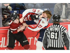 Windsor Spitfires' Michael Renwick and Guelph Storm's Ryan McGuire fight during the first period of Friday's game at the Sleeman Centre.
Tony Saxon/Guelph Today