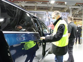 Stellantis CEO Carlos Tavares checks out a vehicle at the Windsor Assembly Plant on Wednesday, Feb. 9, 2022.     Image courtesy of Stellantis