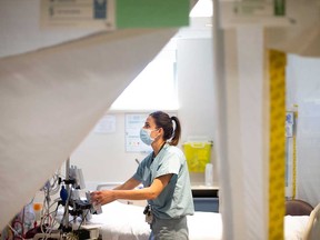 A nurse prepares a room in the intensive care unit at Windsor Regional Hospital's Metropolitan Campus in this May 2020 file photo.