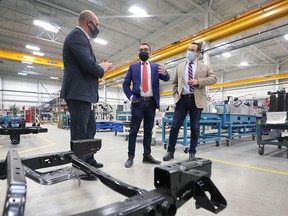 Mike Bilton, left, business development manager with Select Tool Automation gives a tour of the Oldcastle business to Omar Alghabra, Federal Minister of Transport, centre, and MP Irek Kusmierczyk on Wednesday, February 23, 2022.