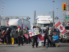 Anti-mandate protests that have shut down incoming traffic from the Ambassador Bridge and limited outgoing traffic, continue to hold a portion of Huron Church, on Wednesday, February 9, 2022.