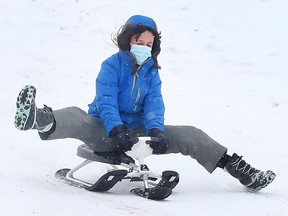 A young visitor to Malden Park in Windsor enjoys the snowy hill on February 3, 2022.