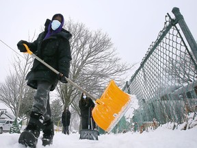 On Feb. 3, 2022, Grade 7 and 8 students from Assumption College Catholic Middle School in Windsor volunteer snow removal in the west end of the city.