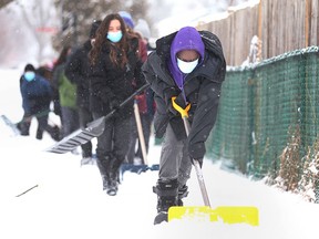 On Feb. 3, 2022, Grade 7 and 8 students from Assumption College Catholic Middle School in Windsor volunteer snow removal in the west end of the city.