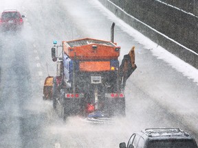 A snow plow is shown on the E.C Row Expressway on Wednesday, Feb. 2, 2022.