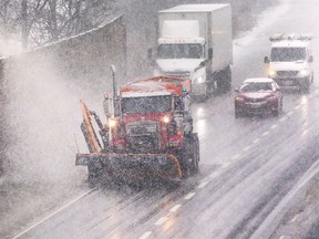 A snow plow is shown on the E.C Row Expressway on Wednesday, February 2, 2022.
