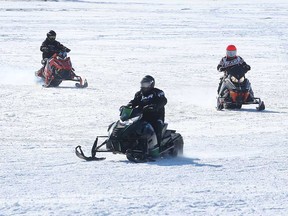 Snowmobile enthusiasts enjoy the ice at Belle River Marina in the Lakeshore area on Jan. 28, 2022.
