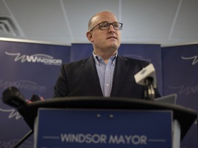 Mayor Drew Dilkens provides an update with Windsor police chief, Pam Mizuno, and deputy chief, Jason Bellaire, on the current security situation on Huron Church Road, on Wednesday, Feb. 16, 2022.