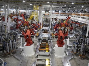 A 2021 Jeep Grand Cherokee L goes through the Framer 1 section of the assembly line at the Stellantis Detroit Assembly Complex-Mack on June 10, 2021 in Detroit, Michigan. The plant is the first new auto assembly plant in Detroit in thirty years, and will manufacture the 2021 Jeep Grand Cherokee L.