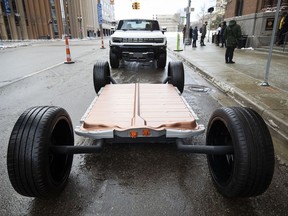 A General Motors Hummer EV chassis sits in front of an Hummer EV outside of an event where General Motors CEO Mary Barra announced that GM is making a $7 billion investment, the largest in the companys history, in electric vehicle and battery production in Michigan on January 25, 2022 in Lansing, Michigan. The investment will be used at 4 facilities in Michigan and will create 4,000 jobs.