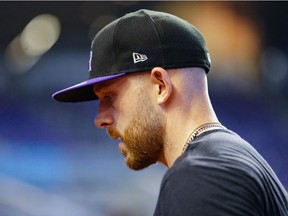 Trevor Story #27 of the Colorado Rockies looks on during batting practice prior to the game against the Miami Marlins at loanDepot park on June 10, 2021 in Miami, Florida.
