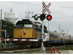 A VIA Rail train blows its whistle as it passes a crossing at Tecumseh Road and Lacasse Boulevard in Tecumseh in 2009.