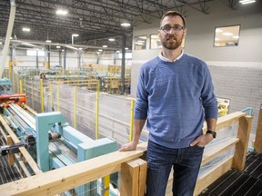 Chris Latour, vice-president of operations at Element5, stands in the company's St. Thomas plant that makes laminated mass timber walls for home construction. (Derek Ruttan/The London Free Press)