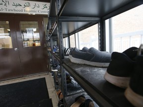 A man enters the Dar Al-Tawheed Islamic Centre mosque to pray in the afternoon.