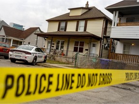 Crime scene tape is shown Friday, March 18, 2022, in front of a home in the 700 block of Brant Street where Windsor police discovered two men shot.