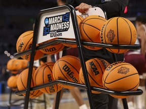 Mar 17, 2022; Fort Worth, TX, USA; A view of the Wilson game basketballs and March Madness and Final Four logos during the second half pf the game between the Kansas Jayhawks and the Texas Southern Tigers in the first round of the 2022 NCAA Tournament at Dickies Arena.