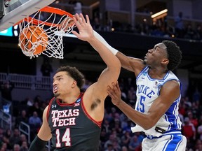 Duke Blue Devils center Mark Williams dunks over Texas Tech Red Raiders forward Marcus Santos-Silva during the second half in the semifinals of the West regional of the men's college basketball NCAA Tournament at Chase Center.