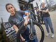 Sofie Waters, left, and Zoe Beaulieu, students at Bike Windsor Essex, use their new bicycle Fix-It station in Old Walkerville to tune up a bicycle, on Friday, March 18, 2022.