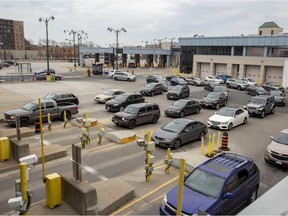 Windsor is hoping to see more cross-border visitors once vaccination restrictions loosen up on April 1. Shown here on Friday, March 18, 2022, are vehicles lined up at the Windsor-Detroit Tunnel customs plaza.