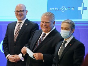 Windsor Mayor Drew Dilkens, left, Ontario Premier Doug Ford and federal Minister of Economic Development, Job Creation and Trade François-Philippe Champagne are shown at a press conference on March 23, 2022, in Windsor where a $5-billion dollar investment to build an EV battery plant in the city was announced.