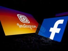 Logos of social networks Facebook and Instagram on the screens of a tablet and mobile phone are seen in Toulouse, France, Oct. 5, 2020.