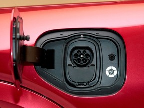 FILE PHOTO: The charging socket is seen on Ford Motor Co's electric Mustang Mach-E vehicle during a photo shoot at a studio in Warren, Michigan, U.S. October 29, 2019.