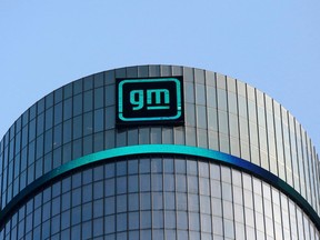FILE PHOTO: The new GM logo is seen on the facade of the General Motors headquarters in Detroit, Michigan, U.S., March 16, 2021.