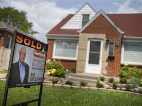 A sold sign is seen on the front lawn of a home on Amiens Avenue in South Walkerville on Wednesday, July 14, 2021.