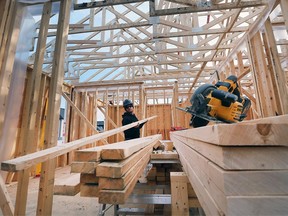 Jordan Ellis, a JS Ellis Construction framer works on a single family housing construction in the 1300 block of Clearwater Avenue in Windsor on Thursday, March 10, 2022.