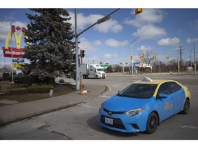 WINDSOR, ONTARIO:. MARCH 12, 2022 - Traffic moves east and west on College Avenue at Huron Church Road as all access points to Huron Church have now reopened, on Saturday, March 12, 2022.