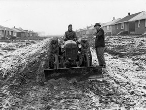 The town of Riverside stepped into the picture to alleviate the mud condition in the 500 block of Isabelle, in Riverside as the town bulldozer was put into action to clear the way of the soft mud and make a bed so that crushed stone can be put along the avenue to give residents a decent street in January 1955.
