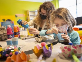 Victoria Whitfield and her daughter, Maisie, 5, as well as dad, Sean Whitfield and eldest daughter, Fiona, 8, (not pictured) take part in some arts and crafts at the Chimczuk Museum on Saturday, March 12, 2022 - the first day of March Break.