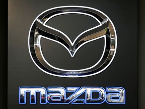 FILE PHOTO: FILE PHOTO: A Mazda logo is seen at a showroom of a dealership in Merignac, near Bordeaux, France, April 8, 2019.