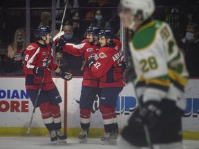 Windsor Spitfires' forward Daniel D'Amico, centre, celebrates a first-period goal with teammates Nathan Ribau and Ryan Abraham, during Sunday's 6-4 win over the London Knights at the WFCU Centre.