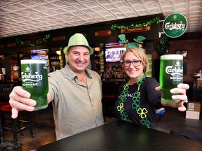 Neil Vaseleniuck, owner of Sir Richard's Wine and Ale House and Danielle Moldovan of Wolfhead Distillery are shown at the Tecumseh bar on Wednesday, March 16, 2022. A big St. Patrick's Day party is planned with live entertainment and green beer.