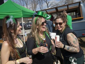 Kylie Beattie, Rebecca Wright, and Rachelle Masse, attend the St. Patrick's Day festivities at the new WindsorEats location on Erie Street East, Thursday, March 17, 2022.