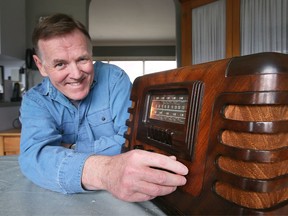 Tony Doucette of CBC Windsor Morning with a vintage radio at his home. Photographed March 30, 2022.