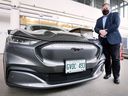 Peter Frize, director of the Center for Automotive Research and Education at the University of Windsor, is shown with a Ford Mach-E electric vehicle at the Faculty of Engineering building Friday, March 25, 2022.