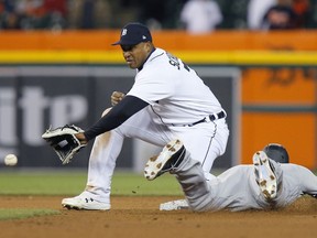Aaron Hicks of the New York Yankees beats the throw to second baseman Jonathan Schoop of the Detroit Tigers to steal second base during the ninth inning at Comerica Park on April 19, 2022, in Detroit, Michigan.