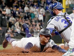 Julio Rodriguez of the Seattle Mariners scores a run against the Kansas City Royals during the seventh inning at T-Mobile Park on April 23, 2022 in Seattle, Washington.