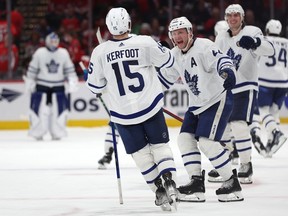 Toronto Maple Leafs forward Alexander Kerfoot is congratulated by teammates after scoring the shootout winner against the Washington Capitals on Sunday night at Capital One Arena.