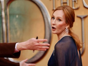 British writer J.K Rowling reacts on the red carpet after arriving to attend the World Premiere of the film "Fantastic Beasts: The Secrets of Dumbledore" in London on March 29, 2022. (Photo by TOLGA AKMEN/AFP via Getty Images)